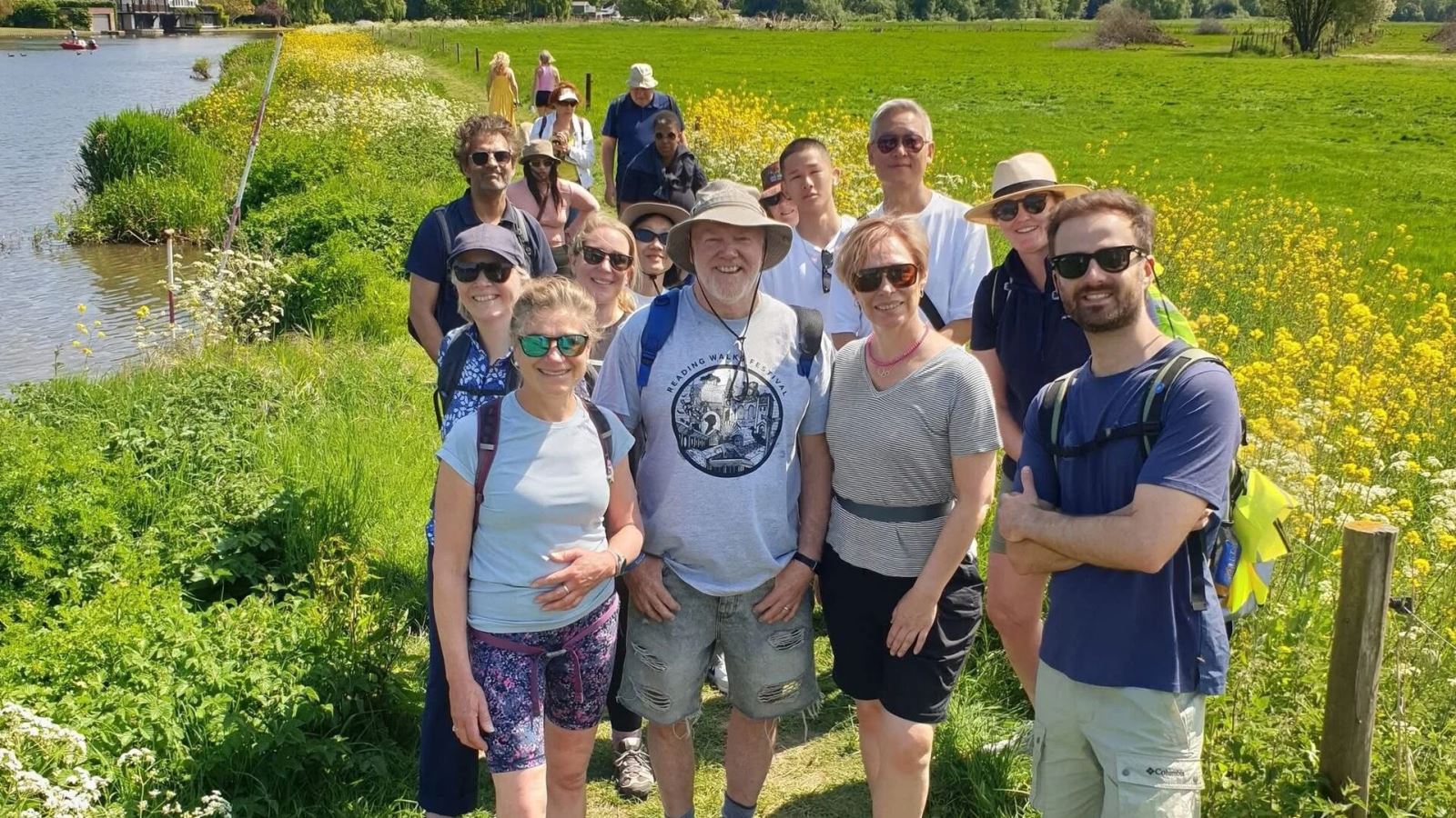 Walkers in field of flowers